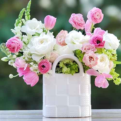 White Purse filled with Ranunculus